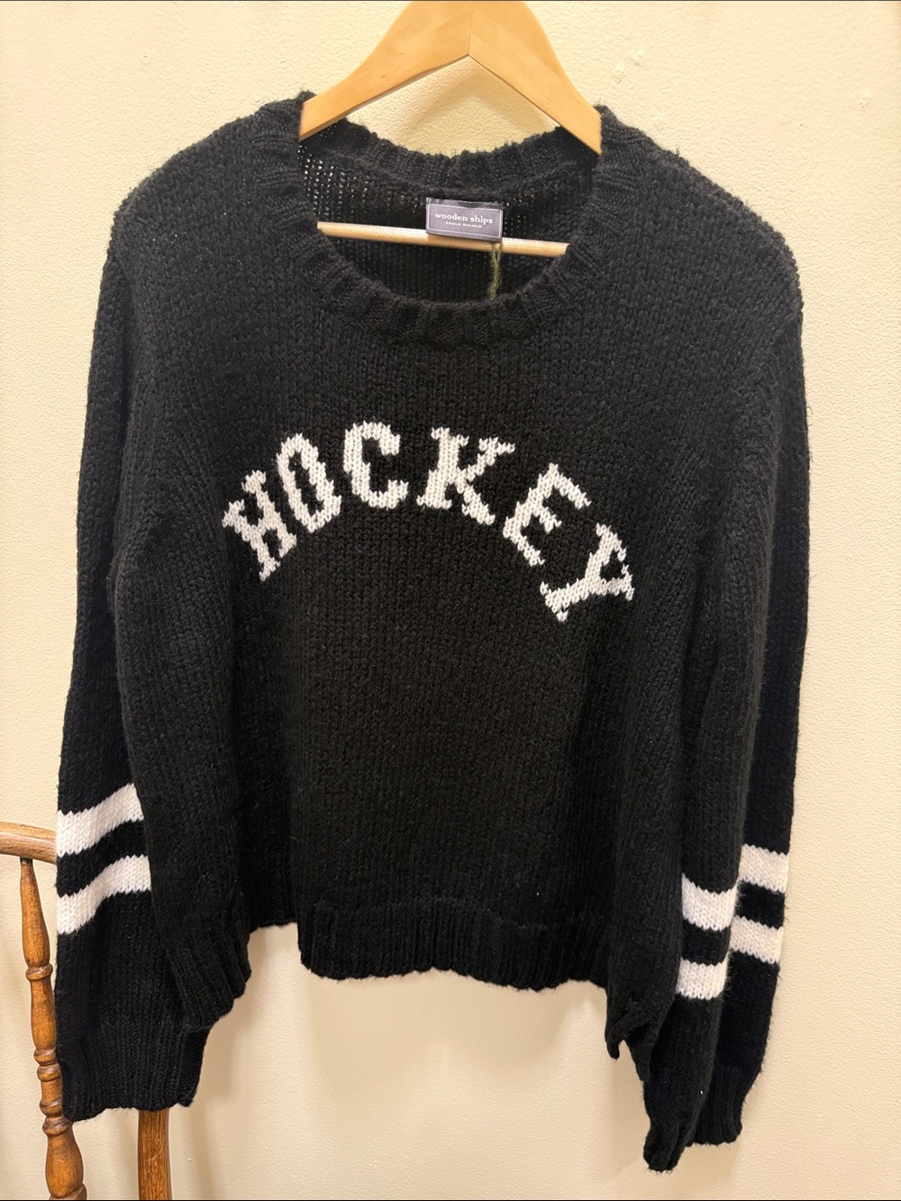 Wooden Ships Black Crewneck Sweater with White 'Hockey' Script